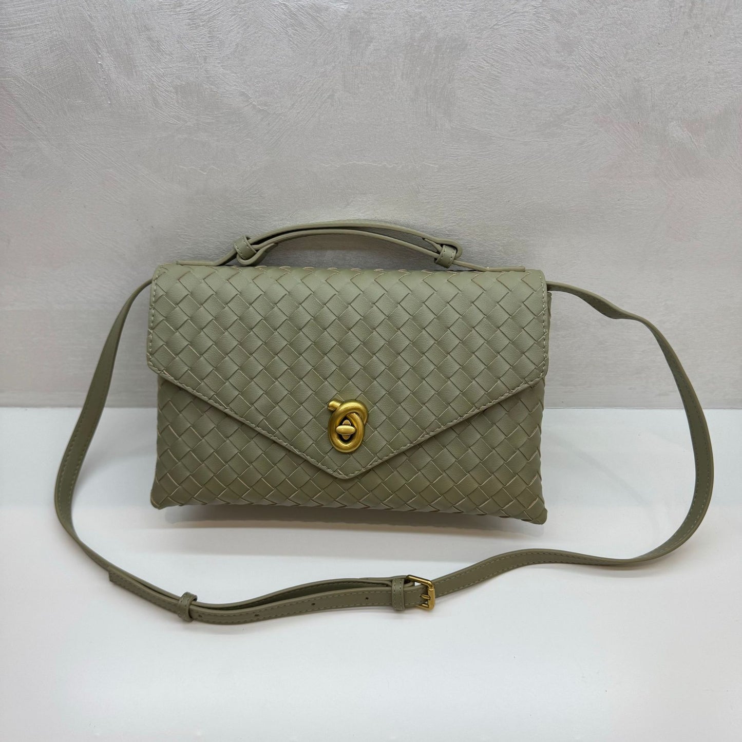 Knot Lock Leather Top Handle Bag