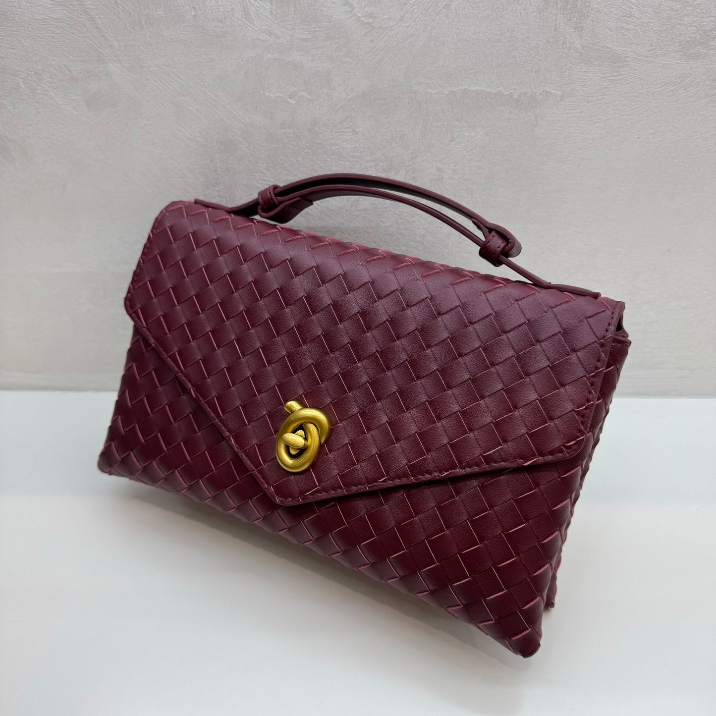 Knot Lock Leather Top Handle Bag