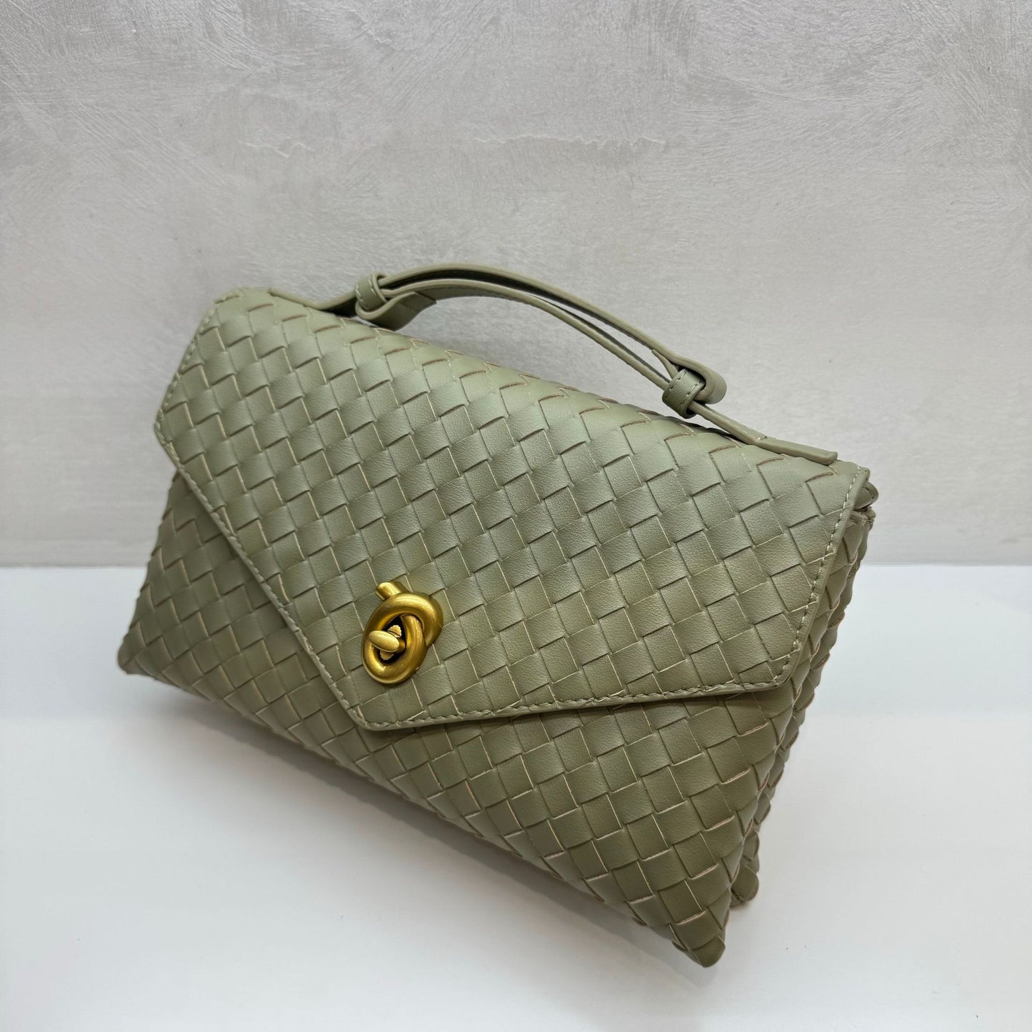 Knot Lock Leather Top Handle Bag
