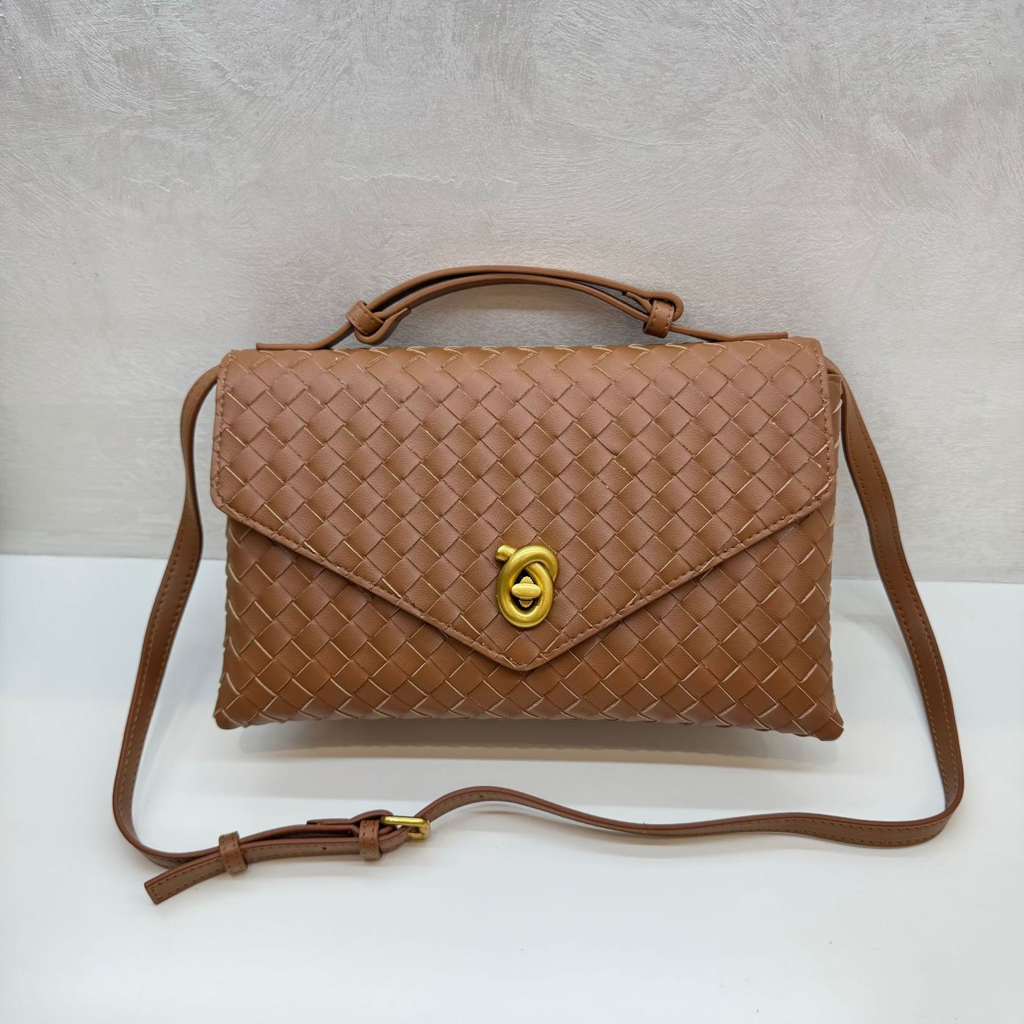 Knot Lock Leather Top Handle Bag