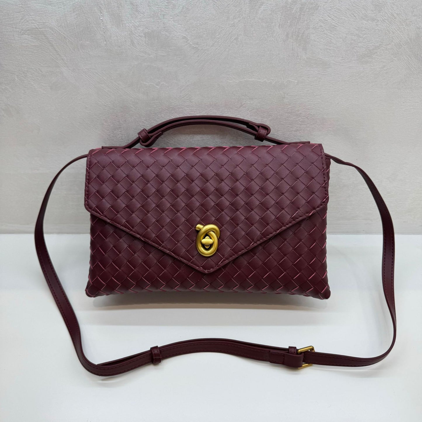 Knot Lock Leather Top Handle Bag