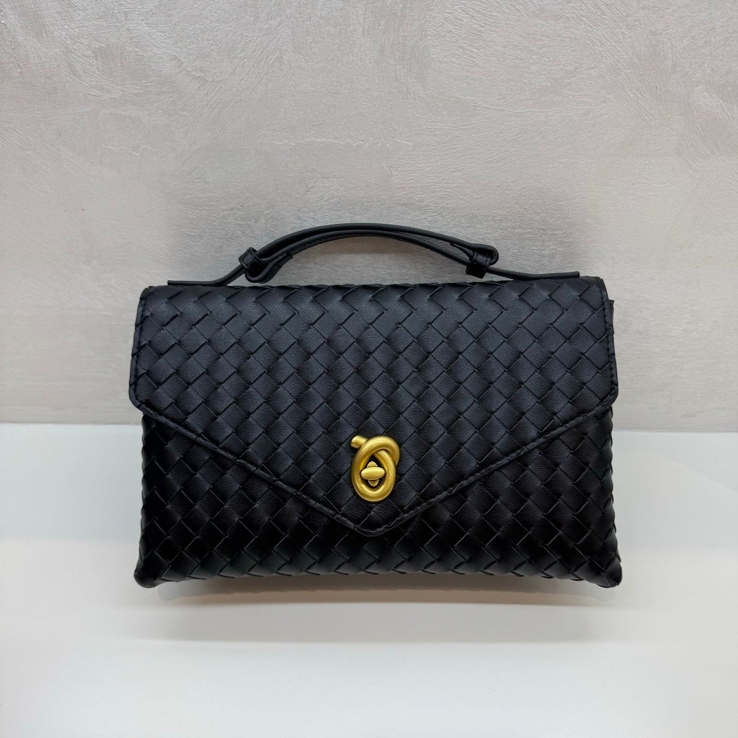 Knot Lock Leather Top Handle Bag