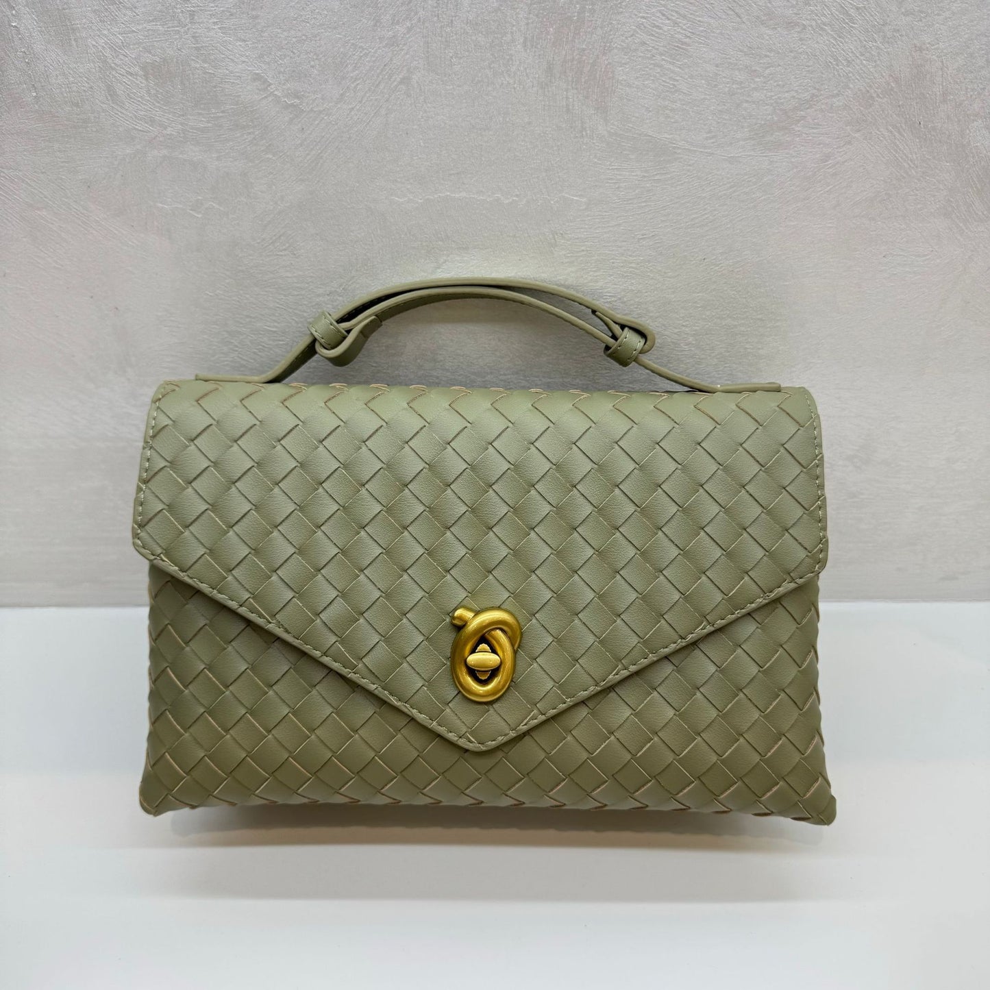 Knot Lock Leather Top Handle Bag