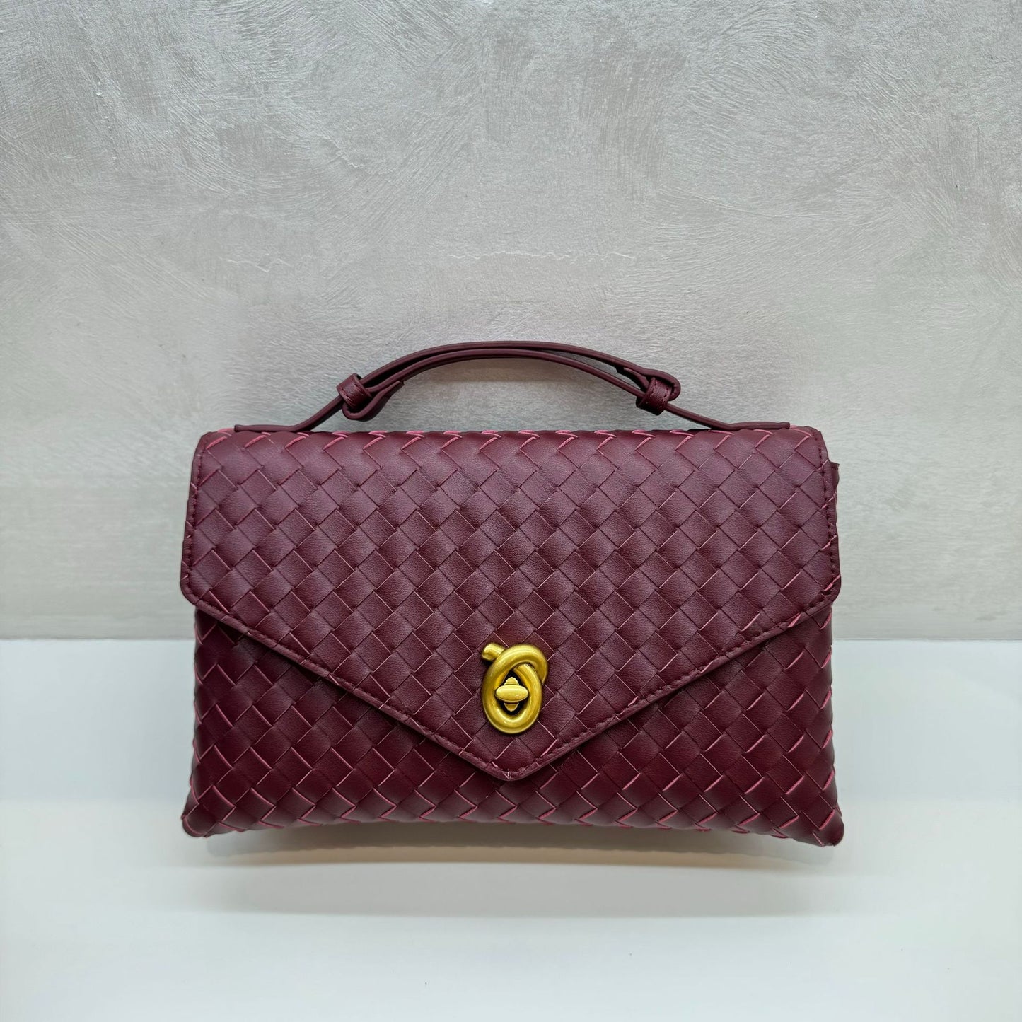 Knot Lock Leather Top Handle Bag