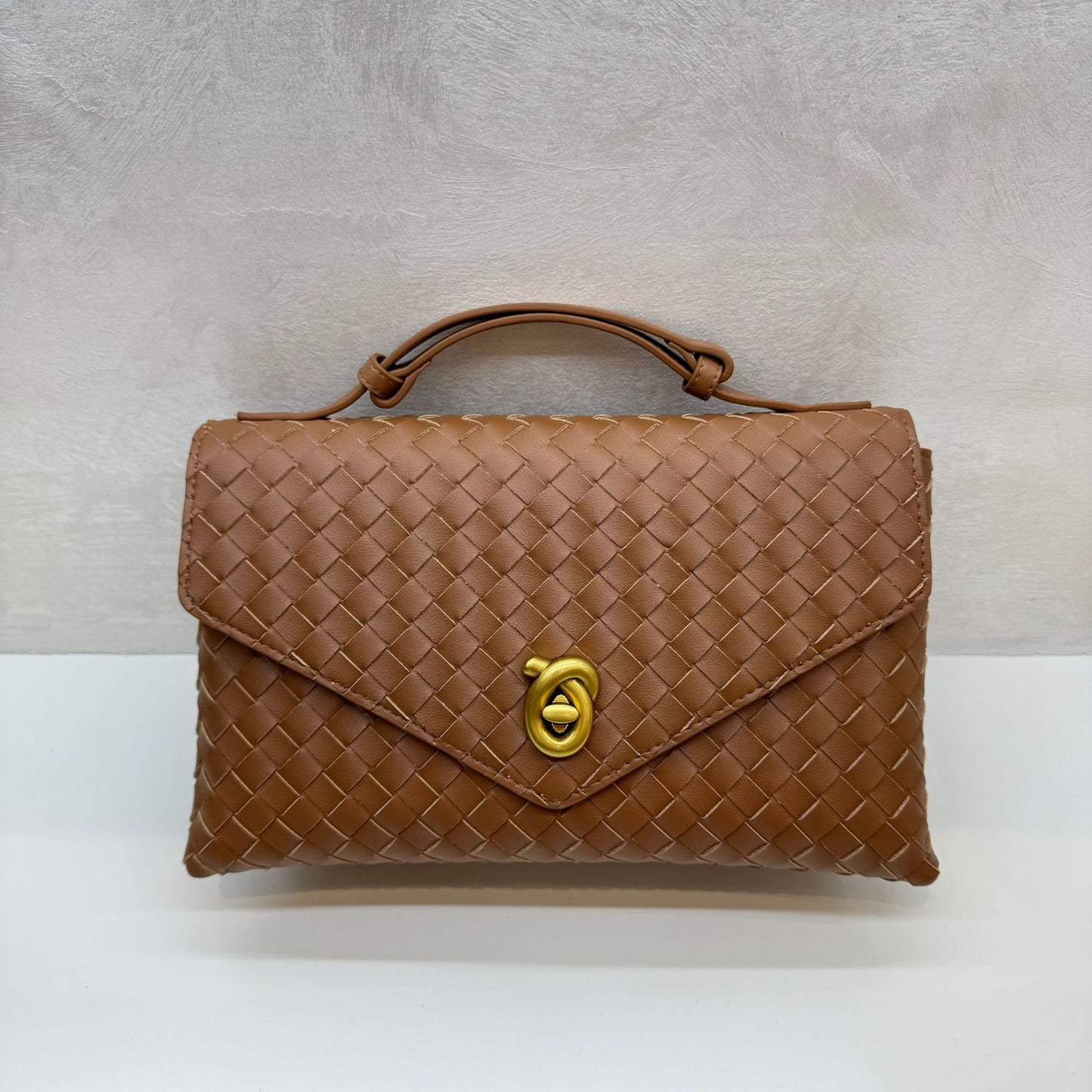 Knot Lock Leather Top Handle Bag